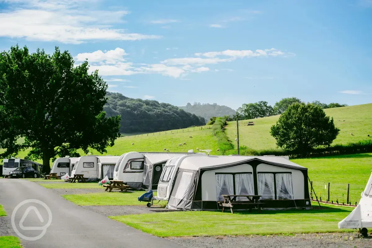 Electric hardstanding and grass touring pitches