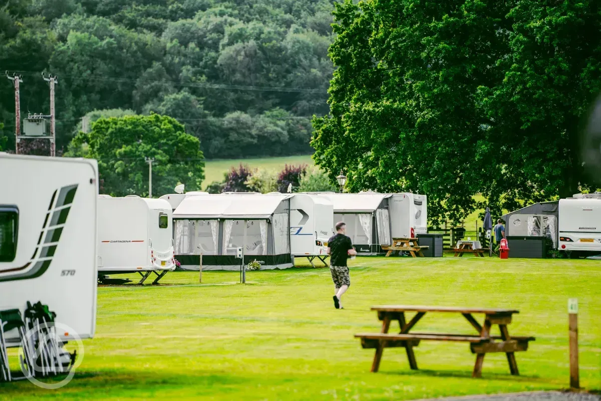 Electric hardstanding and grass touring pitches