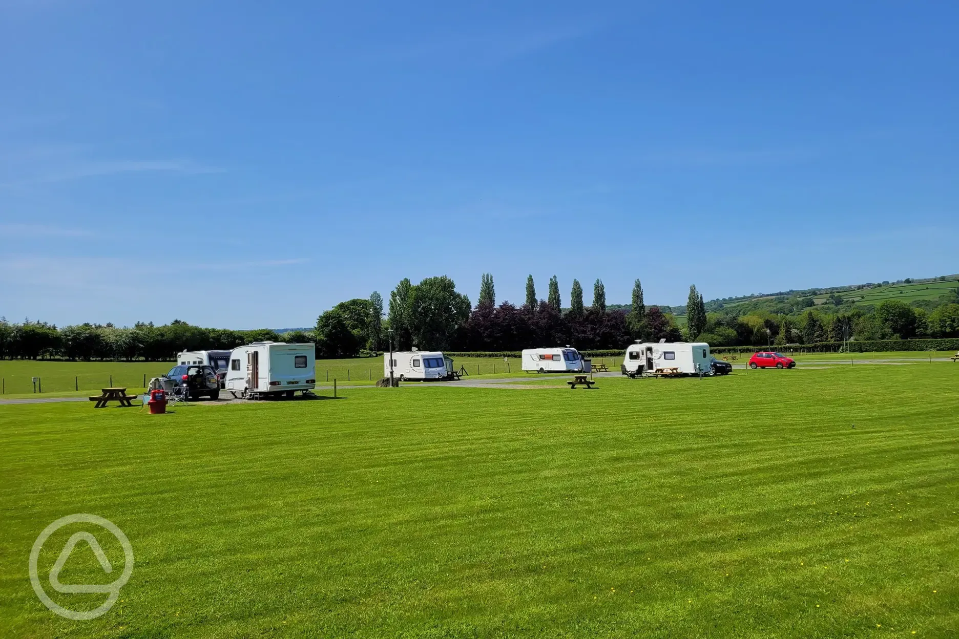 Electric hardstanding and grass touring pitches