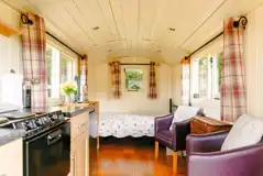 Noddfa shepherd's hut with a double bed (can hire bedding), kitchen and seating Noddfa shepherd's hut with a double bed (can hire bedding), kitchen and seating