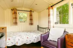Noddfa shepherd's hut with a double bed (can hire bedding), kitchen and seating Noddfa shepherd's hut with a double bed (can hire bedding), kitchen and seating