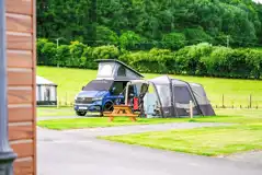 Electric hardstanding and grass touring pitches (5m x 10m) Electric hardstanding and grass touring pitches (5m x 10m)