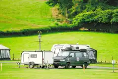 Electric hardstanding and grass touring pitches (5m x 10m) Electric hardstanding and grass touring pitches (5m x 10m)