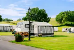 Electric hardstanding and grass touring pitches (5m x 10m) Electric hardstanding and grass touring pitches (5m x 10m)