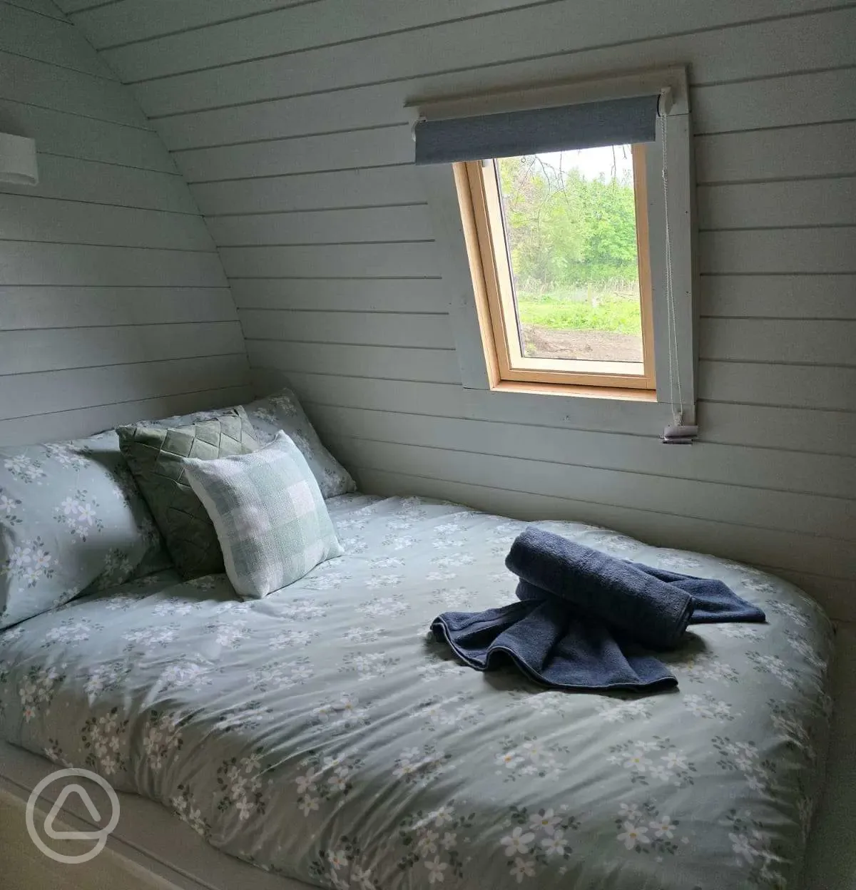 Buttercup ensuite glamping pod bed