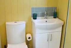 Shepherd's hut ensuite bathroom with a toilet and shower Shepherd's hut ensuite bathroom with a toilet and shower