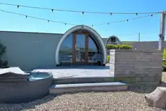 The Pods at Streamvale with hot tubs and string lights The Pods at Streamvale with hot tubs and string lights