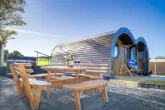 Madonna glamping pod and outdoor seating