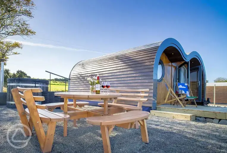Madonna glamping pod and outdoor seating