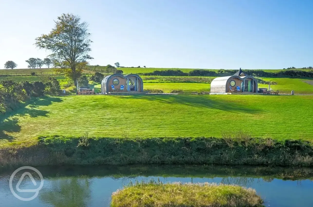 Glamping pods and pond views