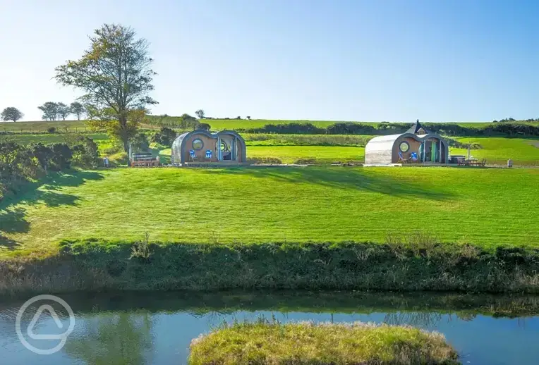 Glamping pods and pond views