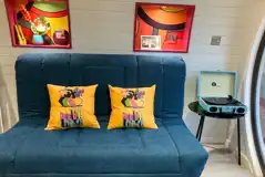 Beatles glamping pod sofa bed and record player