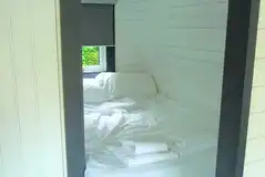 Double bed in the ensuite glamping pods (bedding and towels included)