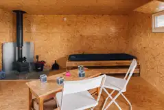 The Camping Bothy interior with single bed frames (please bring sleeping bags)