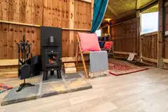 Log burner in the Wandlebury Timber Tent Timber tent 