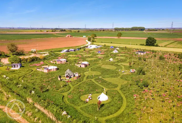 Aerial of Hatters Meadow with grass pitches and glamping