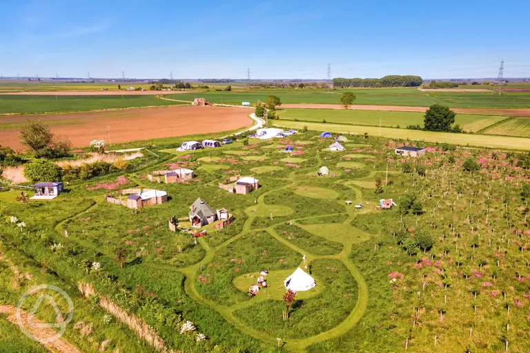 Aerial of Hatters Meadow with grass pitches and glamping