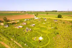 Aerial of Hatters Meadow with grass pitches and glamping