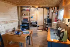 Ensuite Cabin of Heart kitchenette with microwave, sink, kettle, and dining area