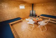 The Camping Bothy interior with four single bed frames