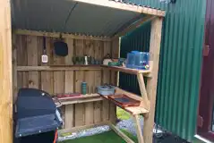 Glamping cabin outdoor cooking area