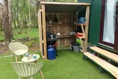 Glamping cabin outdoor cooking area