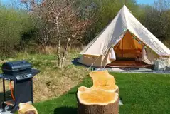Bell tent with outdoor seating and a gas BBQ Bell tent with outdoor seating and a gas BBQ