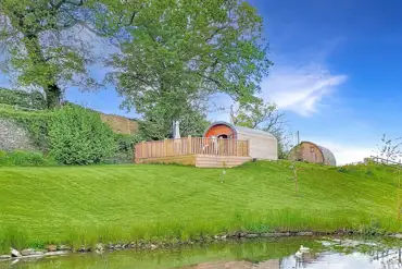 Glamping pods with views of the pond
