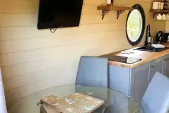 Teilo glamping pod dining area and TV