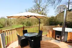 Teilo glamping pod private decking and wood-fired hot tub