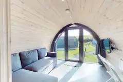 Ensuite glamping pod sofa area and Smart TV
