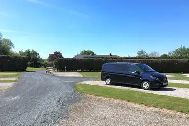 Electric hardstanding touring pitches with car parking space