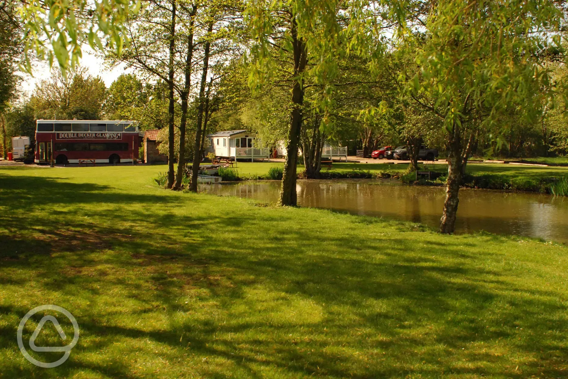Grass pitches by the fishing lake