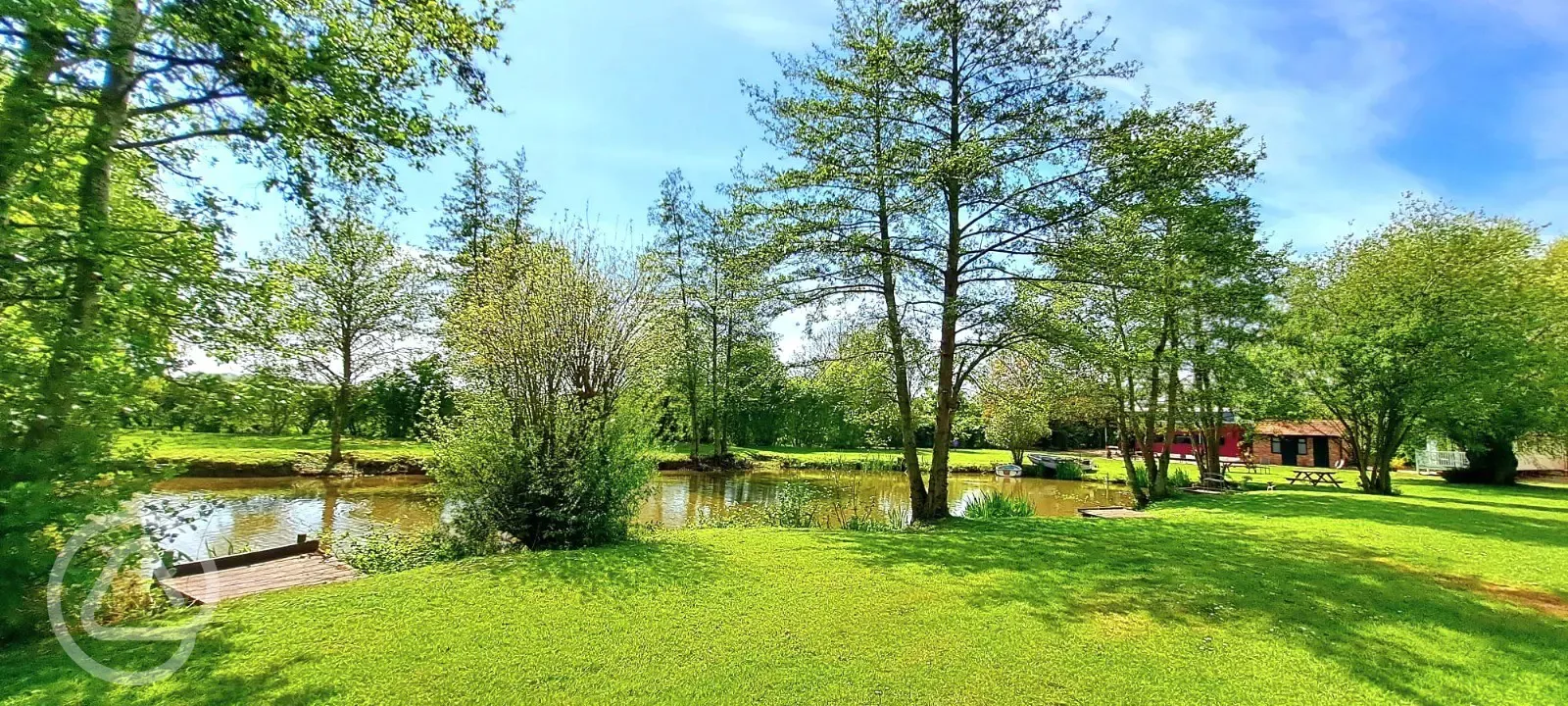 Grass pitches by the fishing lake