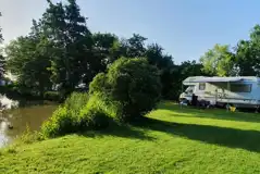 Grass pitches by the fishing lake