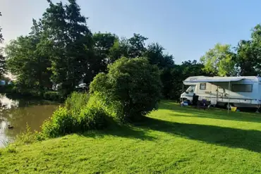 Grass pitches by the fishing lake