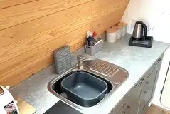 Glamping pod kitchen with fridge, air fryer, microwave, kettle and toaster
