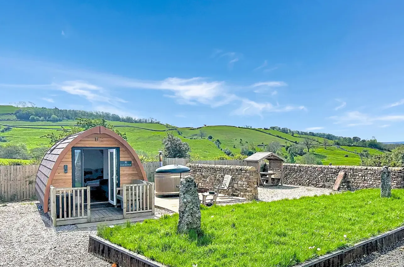 Glamping pod with hot tub and private seating area