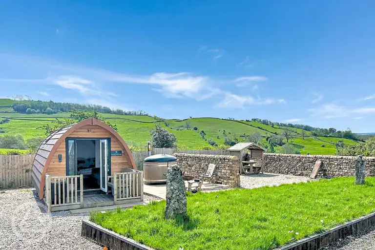 Glamping pod with hot tub and private seating area