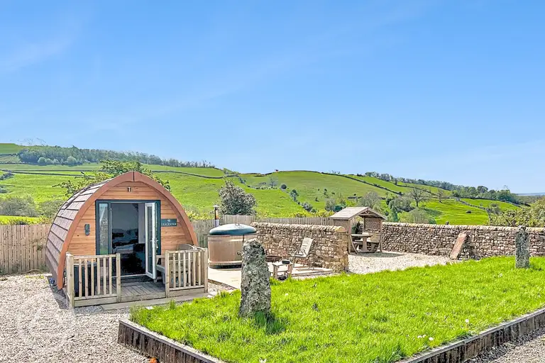 Glamping pod with hot tub and private seating area at Gillcumber Pods