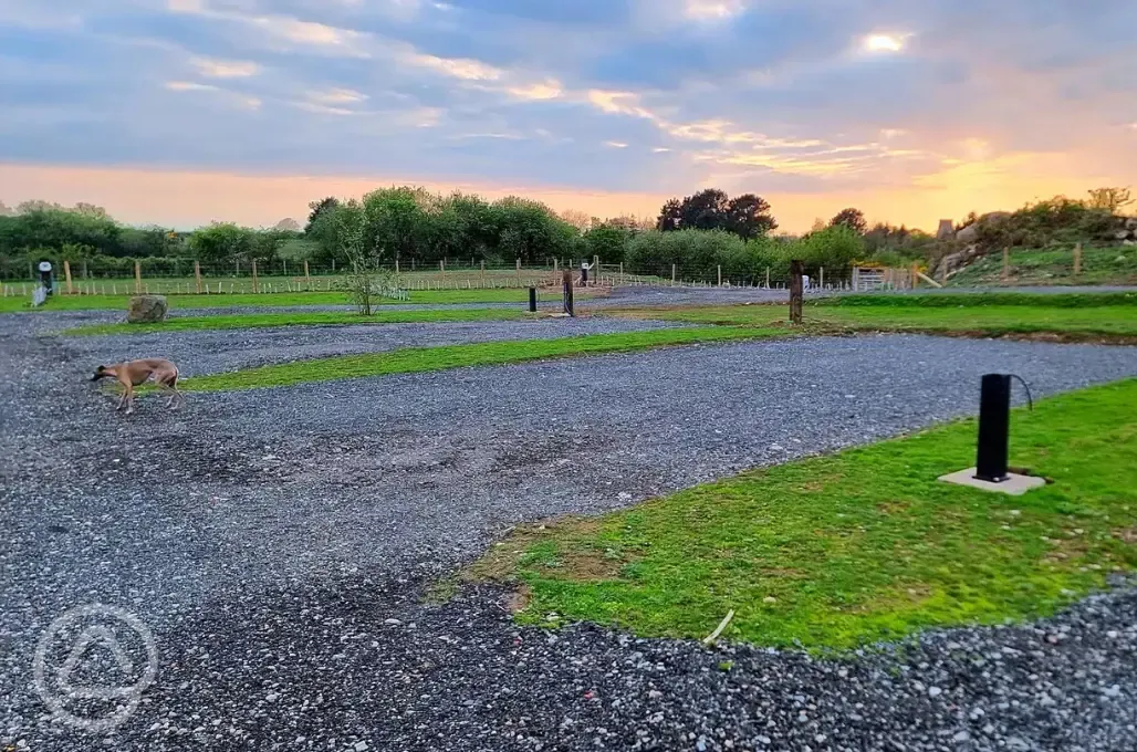 Fully serviced hardstanding pitches at sunset 