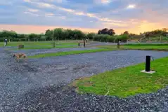 Fully serviced hardstanding pitches at sunset Fully serviced hardstanding pitches at sunset
