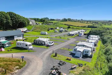Grass (with optional electric) and electric hardstanding pitches by facilities