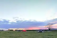 Non electric grass pitches at sunset Non electric grass pitches at sunset