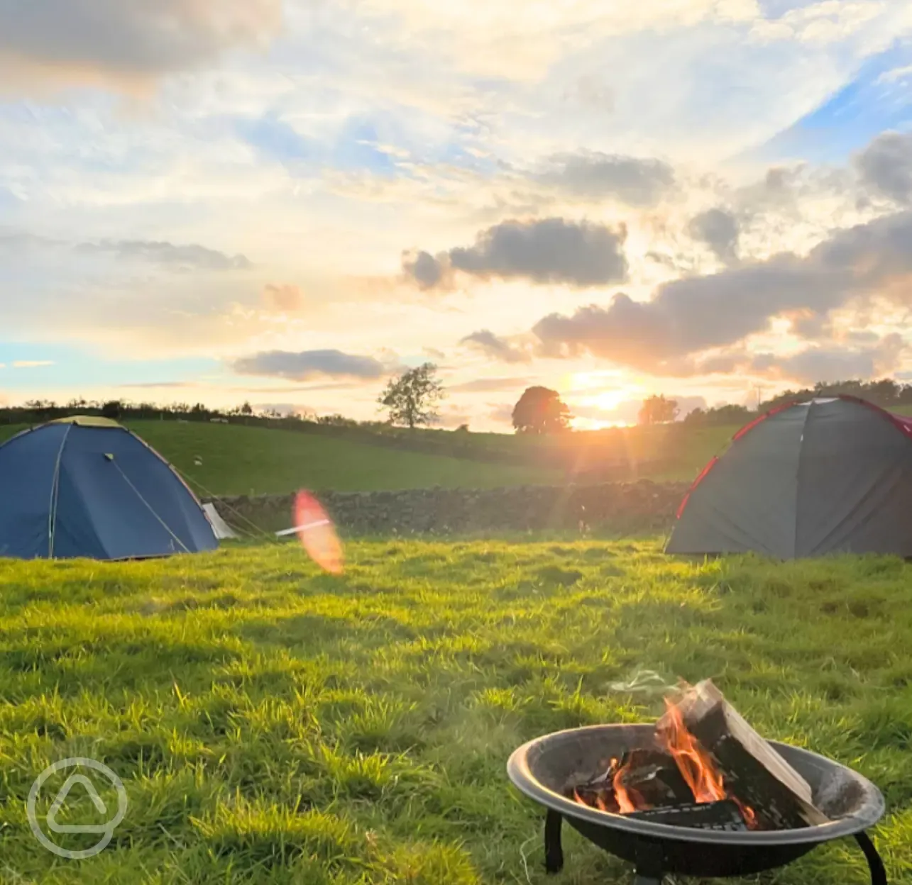 Non electric grass pitches with fire pits welcome