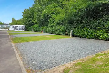 Caravan with awning on a fully serviced hardstanding pitches at Roach Farm Park
