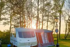 Electric grass pitches at sunset Electric grass pitches at sunset