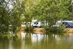 Fully serviced hardstanding touring pitches with lakeside views Fully serviced hardstanding touring pitches with lakeside views