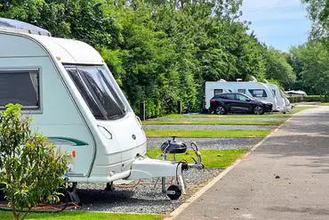 Tourers on fully serviced hardstanding pitches at Roach Farm Park