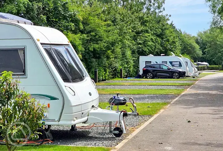 Tourers on fully serviced hardstanding pitches at Roach Farm Park